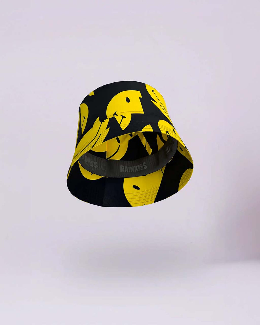 inside of black waterproof bucket hat with yellow smiley print