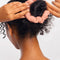 model wearing light pink scrunchie in a ballerina bun
