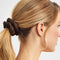 model wearing brown scrunchie in a ponytail