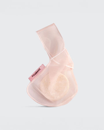 pink shampoo bar bag with bar inside