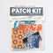 packaged patch kit with various fabric pieces and colorful embroidery thread