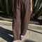model wearing brown cotton relaxed pants