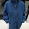 model wearing buttoned relaxed denim jacket with longer length and tan corduroy collar