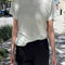 model wearing a white linen blend relaxed fit t-shirt