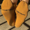bottoms of model wearing mustard breezy sneaker socks