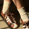 model wearing cream breezy sneaker socks