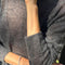 up close of model wearing charcoal mohair crew neck sweater