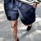 model wearing navy cotton shorts