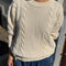 model wearing naturel cable knit crew neck sweater