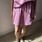 model wearing dusty lilac cotton basketball shorts with matching tee