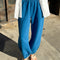 model wearing french terry teal blue balloon pants with side pockets