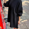 model wearing black french terry swing dress
