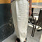 side view of model wearing cream pants with workmen patches down the front and inner drawstring