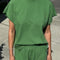 model wearing asparagus tee with small side vents and muscle tee sleeves