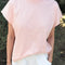 model wearing baby pink relaxed fit cotton tee with muscle type sleeves and side vents