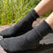 model wearing charcoal grey ribbed scalloped socks