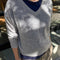 model wearing light grey v-neck sweater