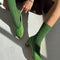 model wearing model wearing palm green pointelle socks