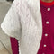 model wearing naturel pointelle square shawl with scalloped edges