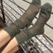 side view of model wearing olive green mohair crew socks