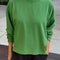 model wearing asparagus long sleeve tee with elastic arm bands and relaxed fit