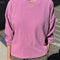 model wearing dusty lilac long sleeve tee with elastic arm bands and relaxed fit