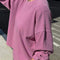 model wearing dusty lilac long sleeve tee with elastic arm bands and relaxed fit