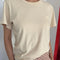 model wearing light tan relaxed fit t-shirt