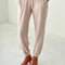 model wearing light pink pointelle jogger pants