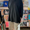 model wearing slate grey long sleeve tee with deep side vents