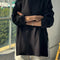 model wearing black long sleeve tee with deep side vents