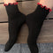 model wearing black socks with red ruffle trim