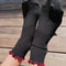 model wearing black socks with red ruffle trim