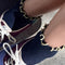 model wearing navy socks with butter ruffle trim
