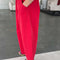 side view of model wearing crayon red cotton pants with pockets