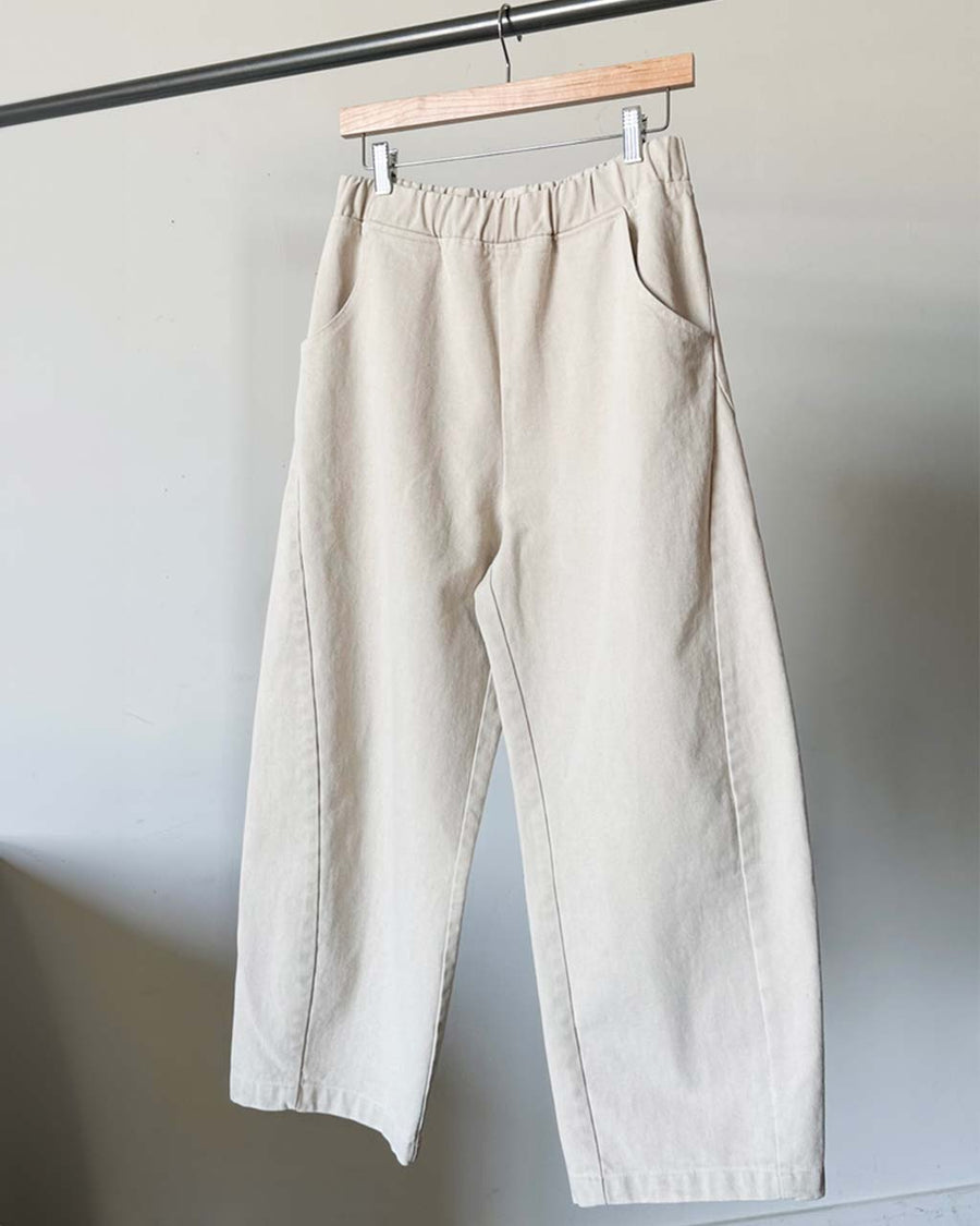 cream cotton pants on hanger