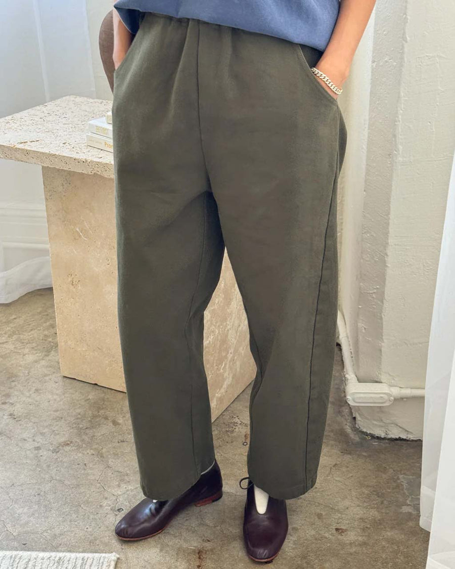 model wearing olive relaxed fit pants