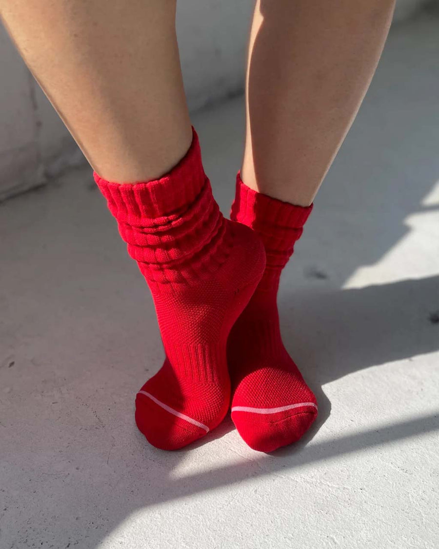model wearing strawberry red socks with high cuff