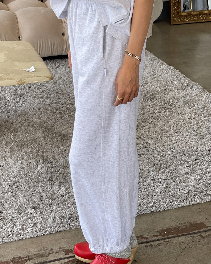 side view of model wearing light heather grey balloon pants