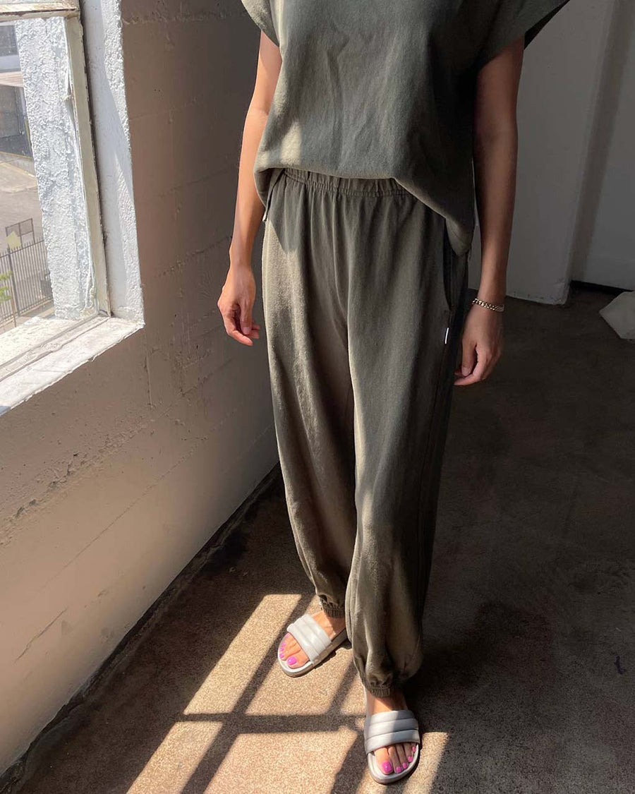 model wearing olive green cotton pants