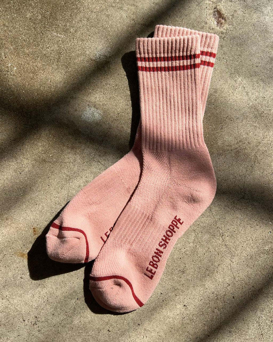 pink socks with two red stripes
