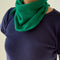 model wearing kelly green bandana around their neck