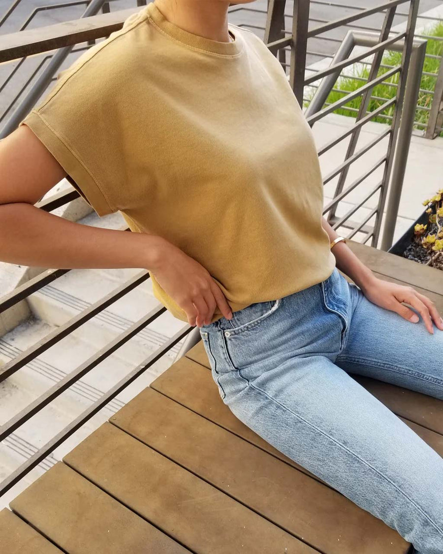 model wearing butterscotch relaxed fit vintage tee and jeans