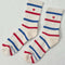 white socks with red and blue multiple stripe socks with embroidered red heart
