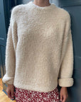 model wearing sand fuzzy relaxed fit sweater