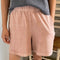 model wearing peach colored cotton shorts
