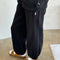side view of model wearing black french terry balloon cotton pants