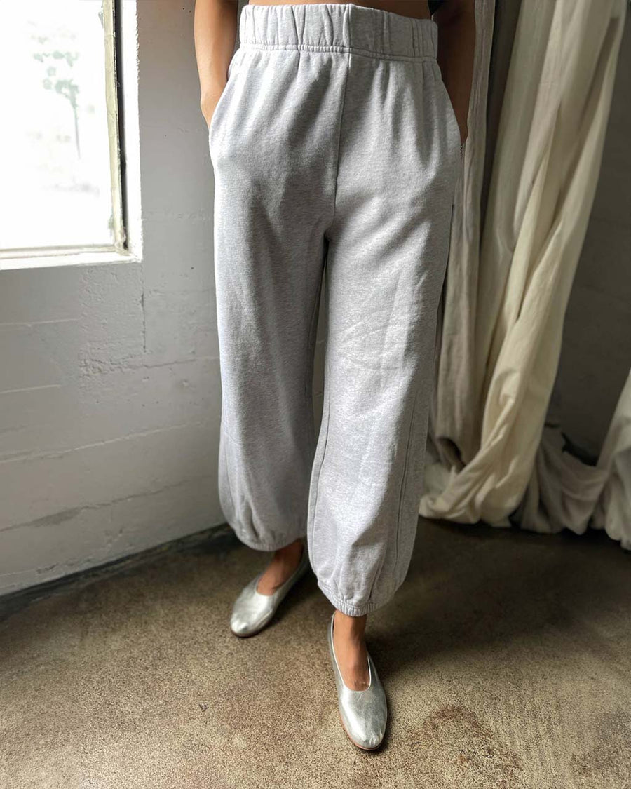 model wearing heather grey balloon pants with wide waistband