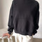 model wearing black pullover cotton sweatshirt with kangaroo pocket