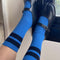 model wearing royal blue socks with navy stripes on top